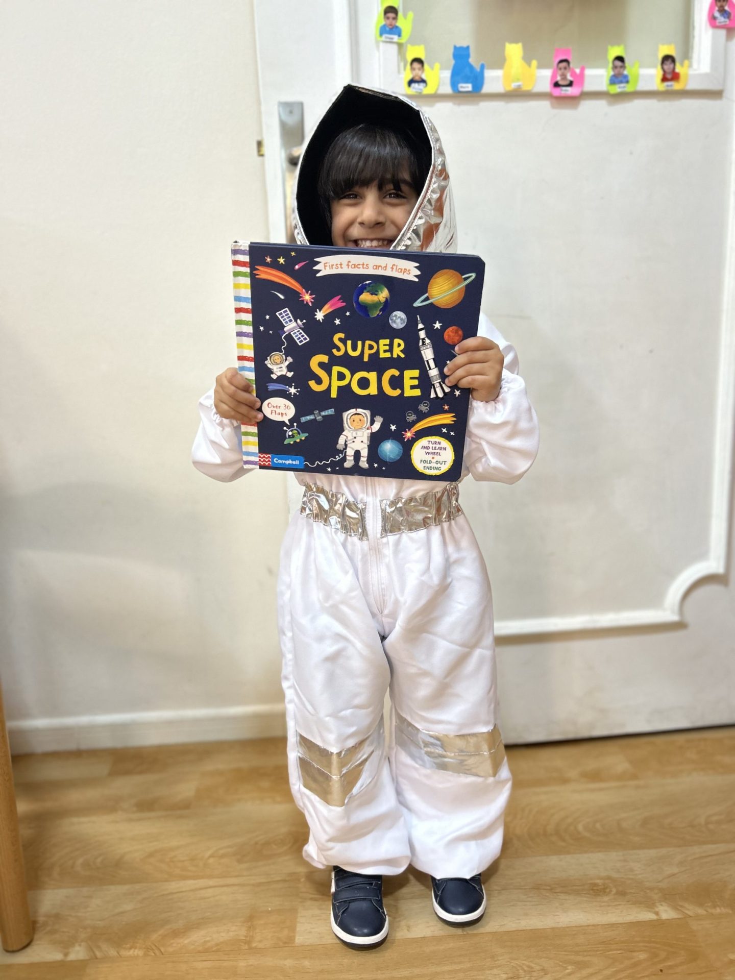 Kid cosplays as an astronaut at Nursery in Rashidiya
