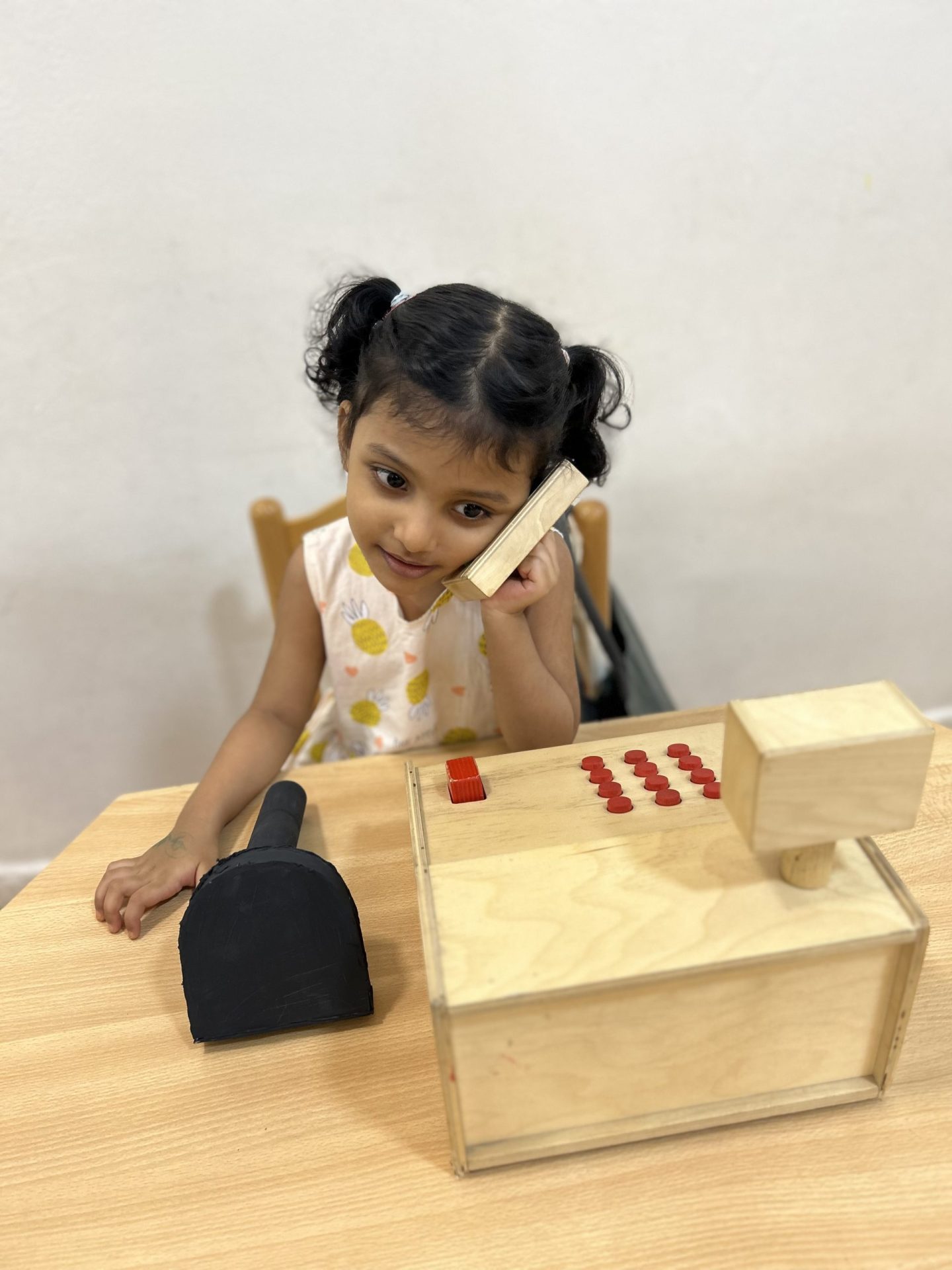 Kids playing with wooden toys at Nursery in Silicon Oasis