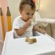 Toddler enjoying cake at Best Nursery in Mirdif