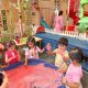 children playing with paint in nursery